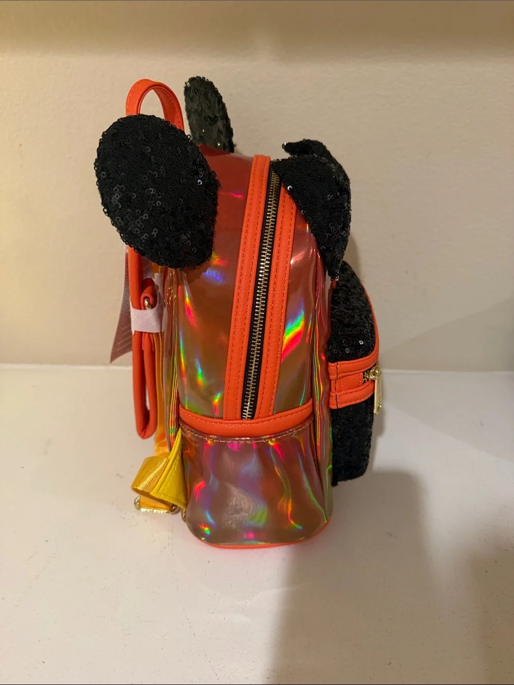 Loungefly Kids Iridescent Orange Mini Backpack with Black Sequin Bow & Ears